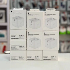 Stack of Apple 40W Dynamic Power Adapter boxes